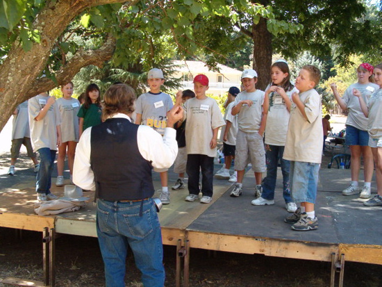 John Muir and kids do a group exercise
